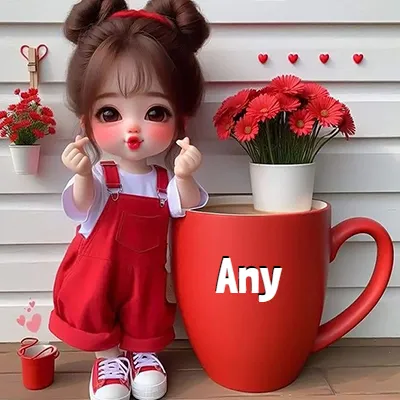 Niña pequeña con ropa roja haciendo gesto de corazón con los dedos, junto a una taza roja gigante llena de gerberas rojas. - Any